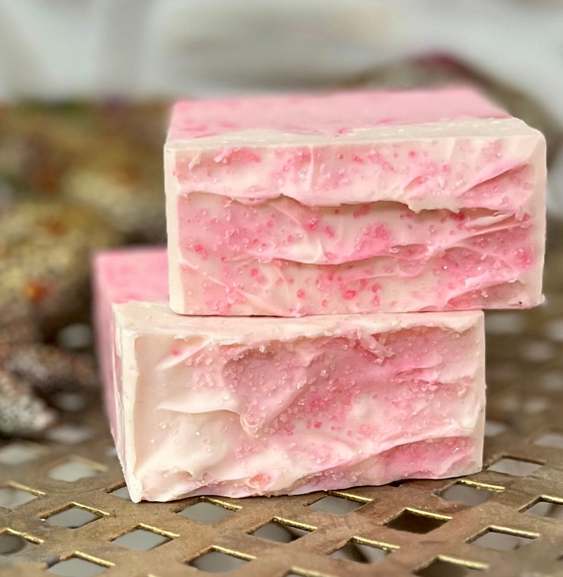 Close-up of Black Cherry Swirl Soap showing intricate pink swirls and creamy texture.